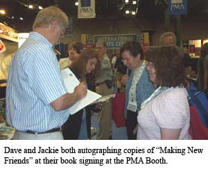 Dave and Jackie both autographing copies of Making New Friends